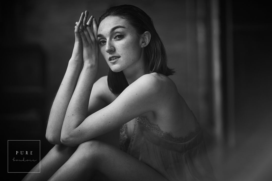 woman looking at camera sensual black and gray chicago boudoir