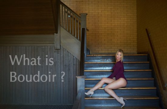 woman sitting on stairs in boudoir lingerie session