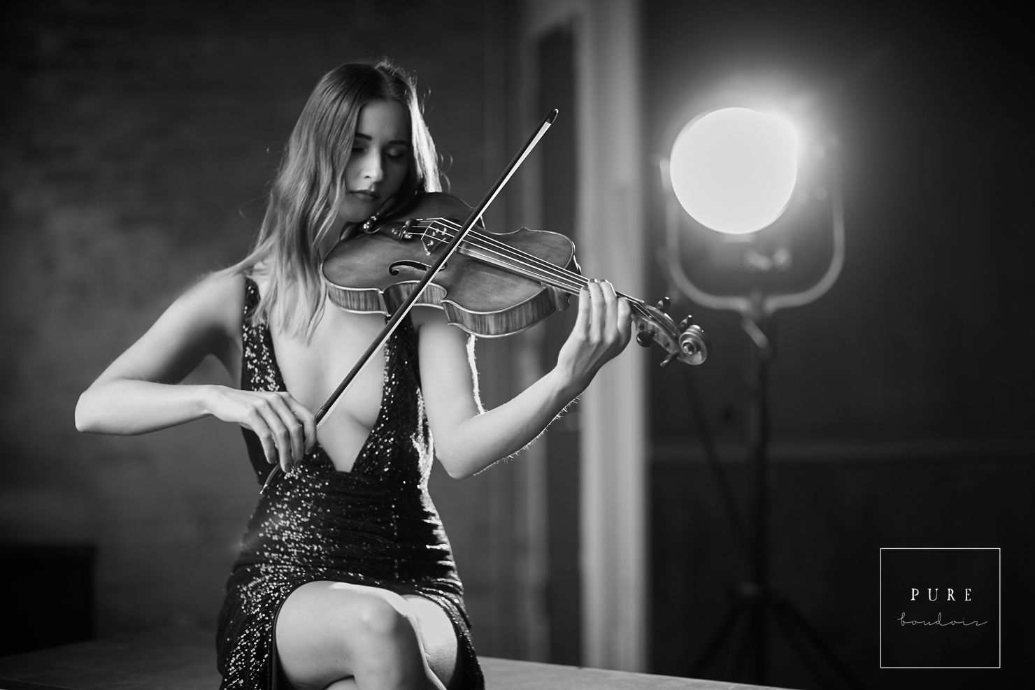 woman playing violin in sparkling dress chicago boudoir black and white photography