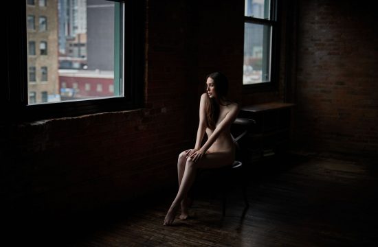 nude boudoir woman staring through window chicago