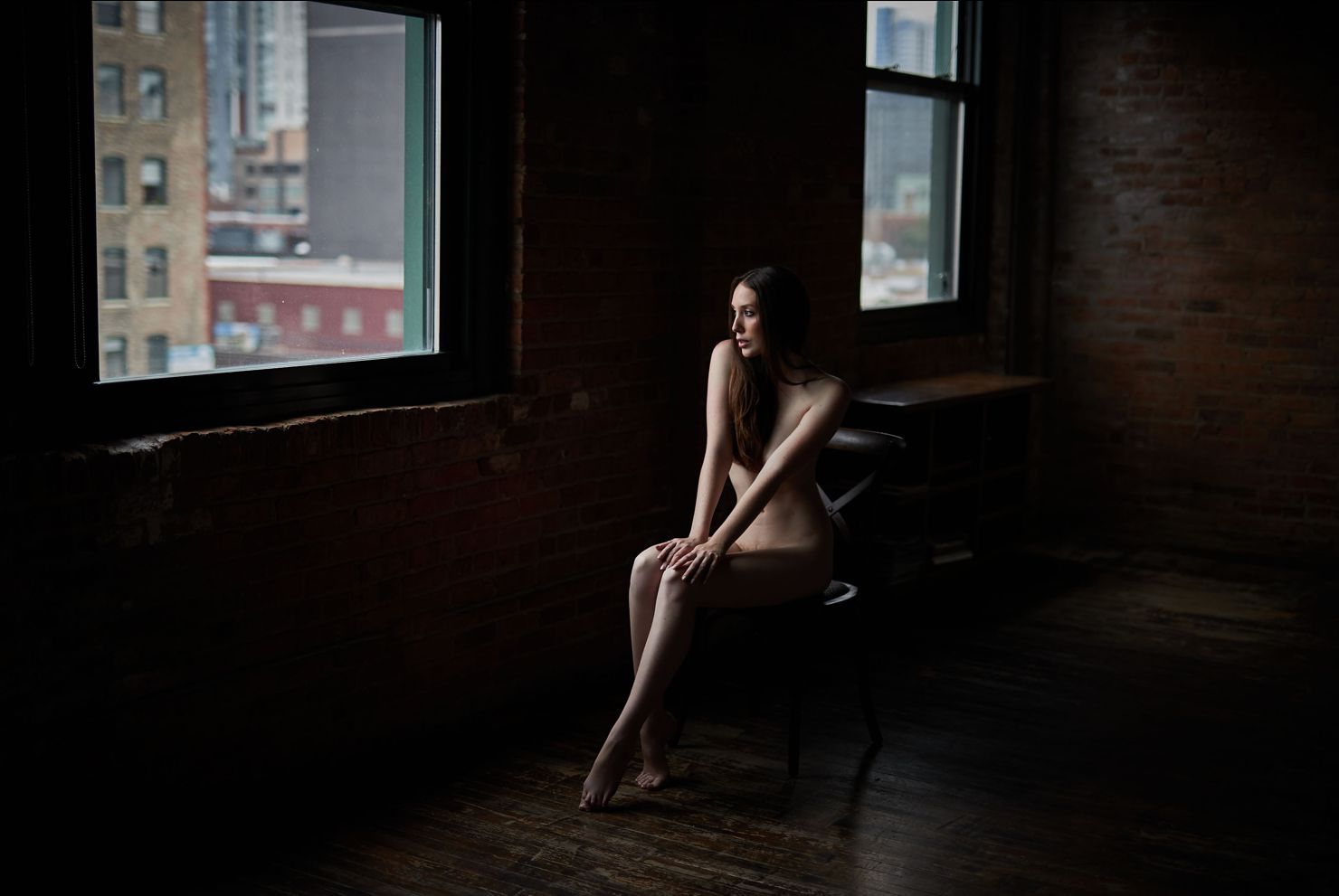 nude boudoir woman staring through window chicago