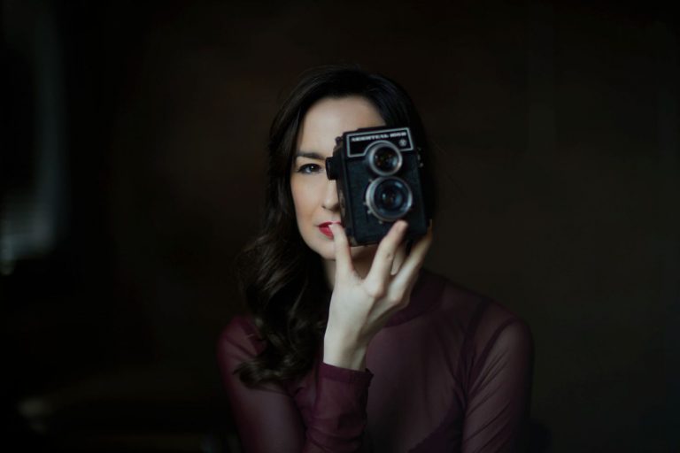 photographer holding camera chicago boudoir
