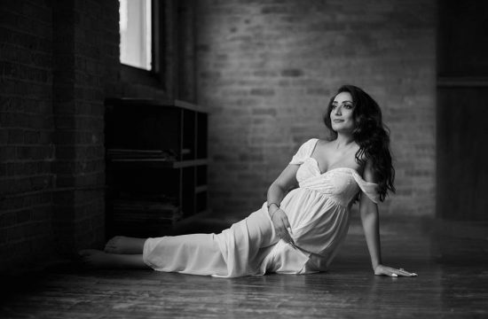 pregnant woman in white dress maternity boudoir black and white photography
