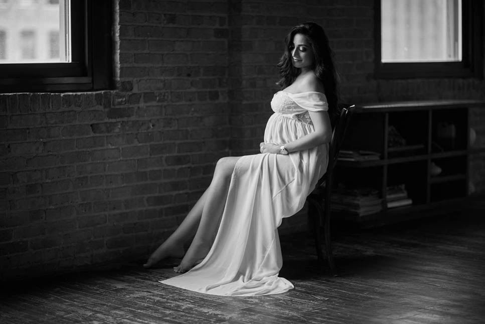 pregnant woman in white dress maternity boudoir black and gray