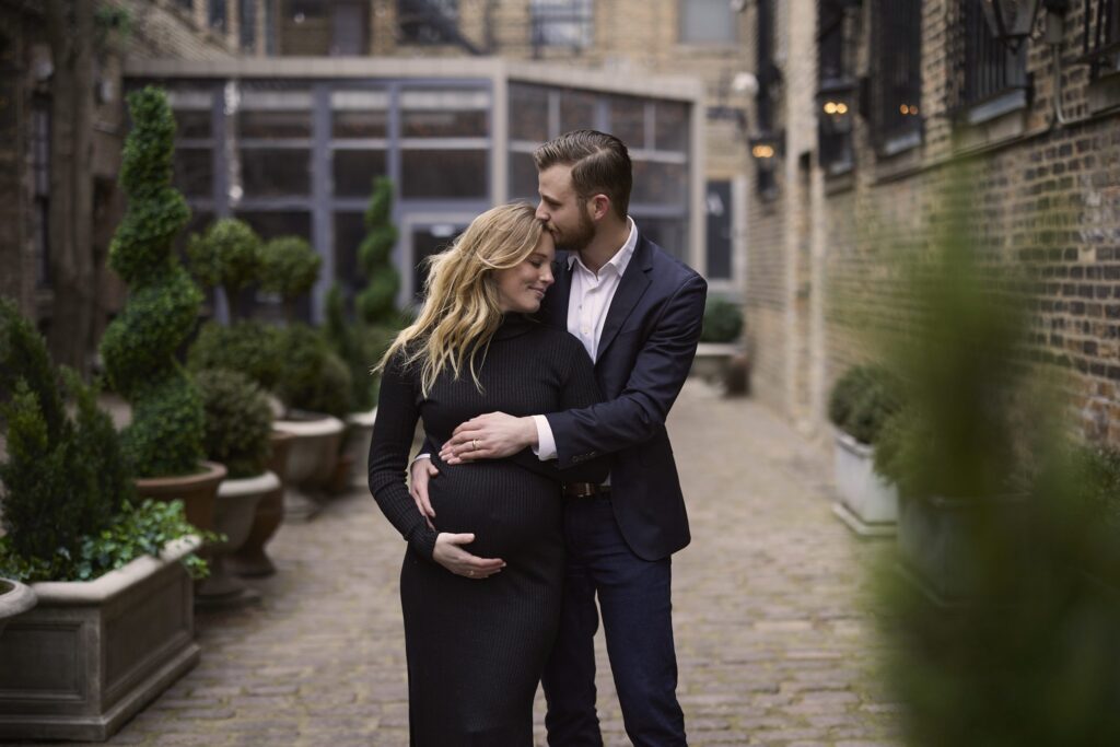 husband and wife in outdoor maternity photography session