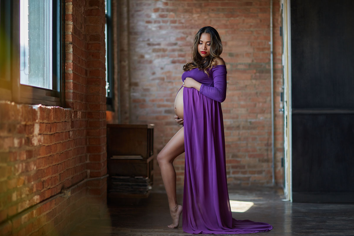 pregnant woman in purple dress maternity boudoir