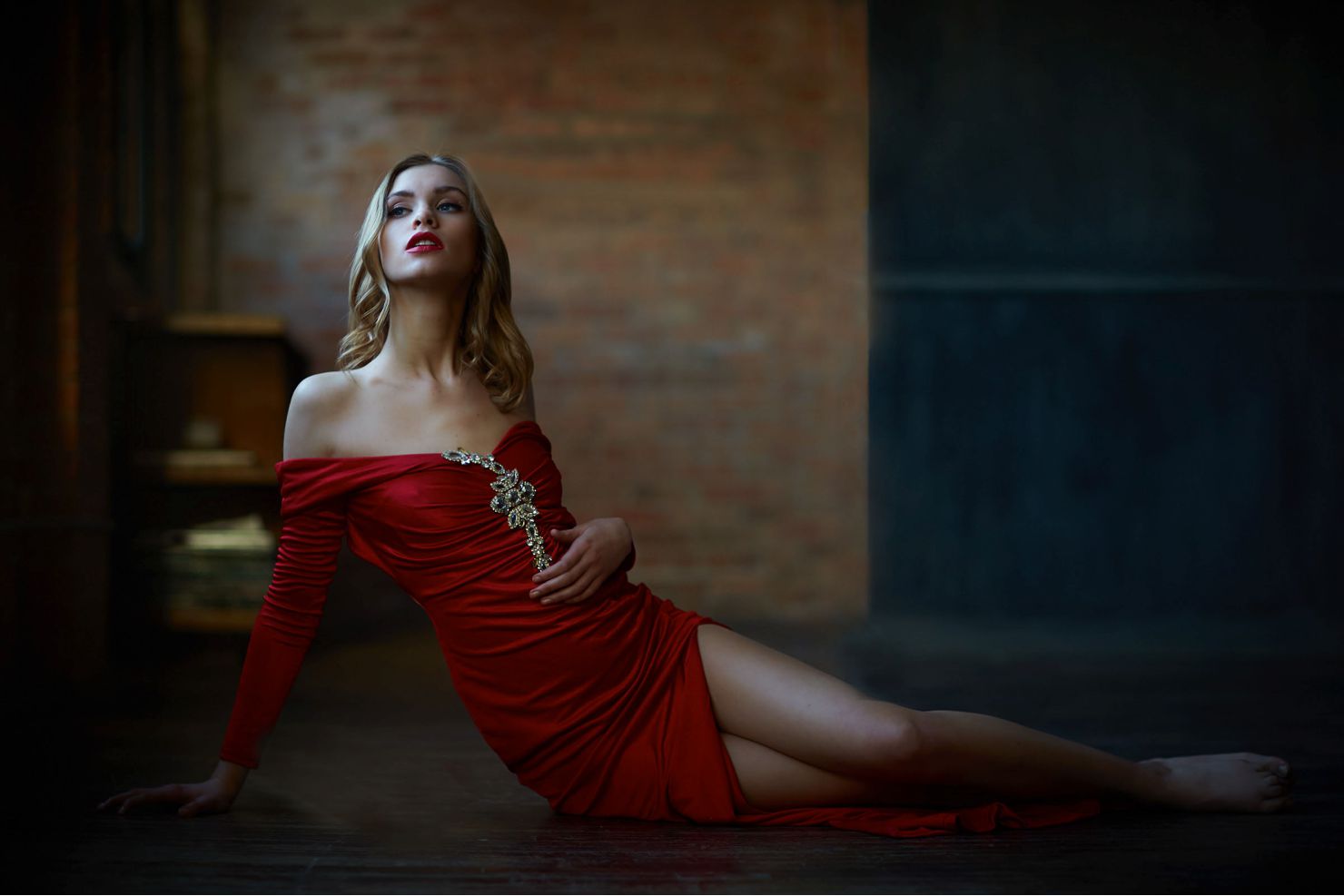 woman posing on ground in red dress chicago boudoir